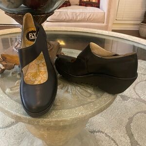 Fly London Black Leather Wedge Mules